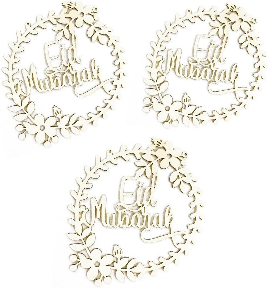 Three 'Eid Mubarak' decorative elements with floral wreaths on a white background