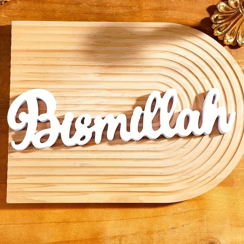 Wooden plaque with 'Bismillah' text on a wooden surface