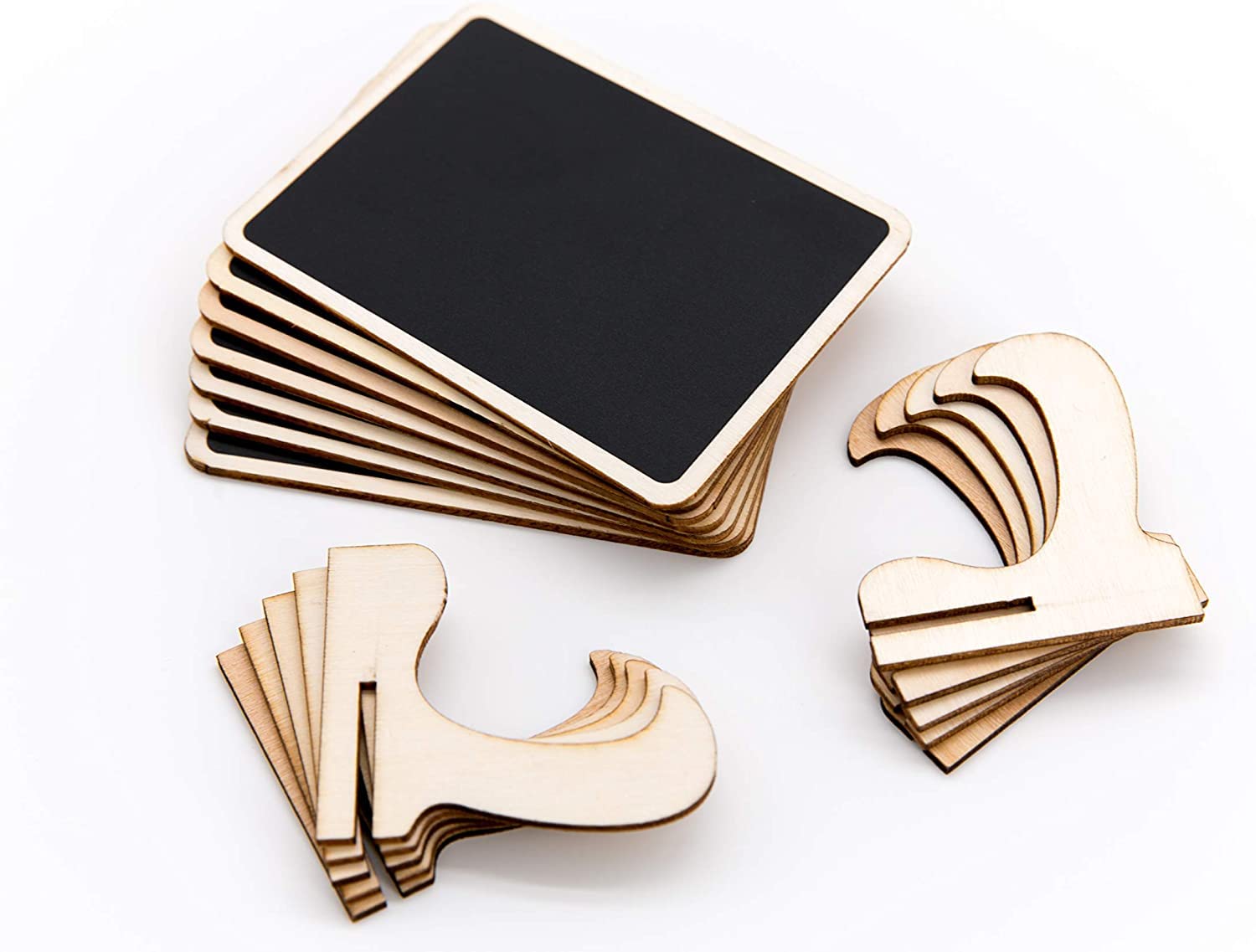 Set of wooden coasters with black surface on a white background