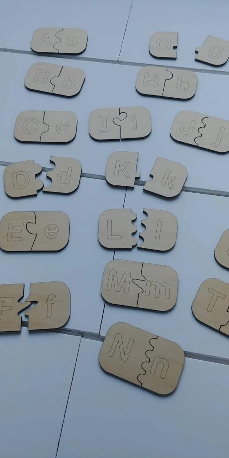 Wooden puzzle letters scattered on a tiled floor