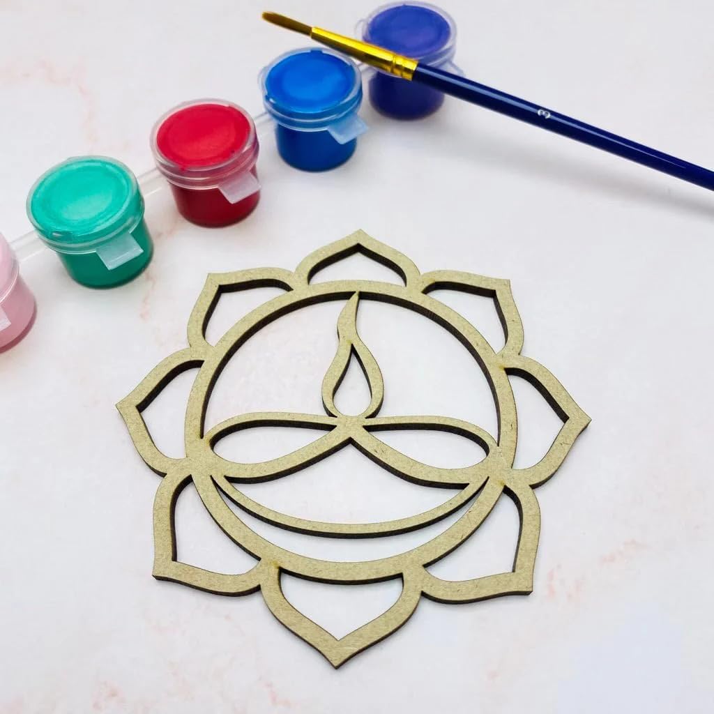 Decorative metal cutout of a lotus flower design with paint containers and a brush on a light background