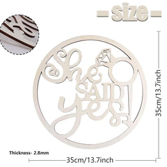 Decorative wooden cutout with 'She Said Yes' text and ring design, showing size and thickness measurements.
