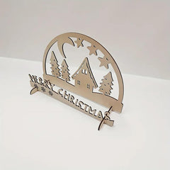 Wooden Christmas decoration with 'Merry Christmas' text and cabin design on a white background