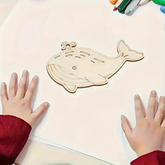 Wooden whale puzzle on a white surface with child's hands reaching towards it.