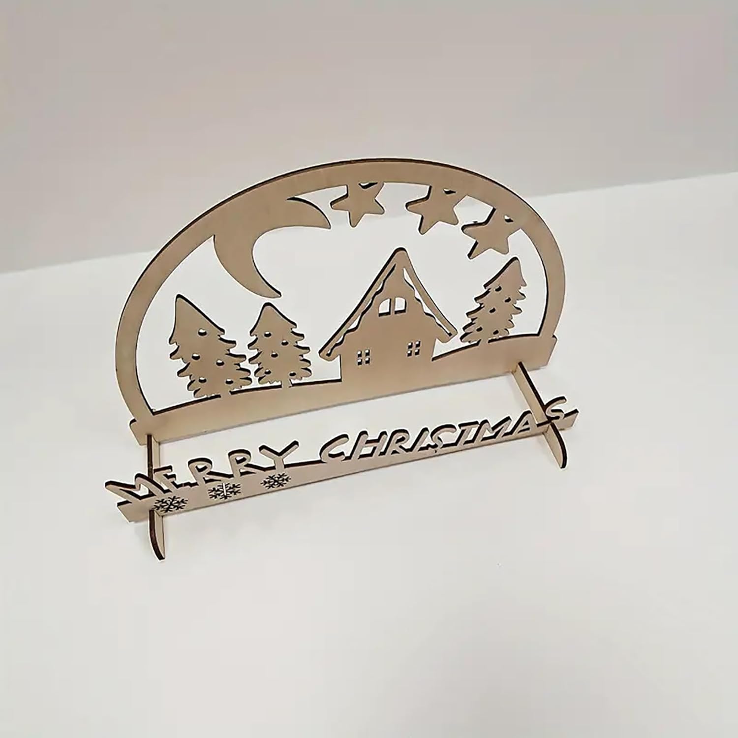 Decorative Christmas sign with a cabin and trees design on a white background