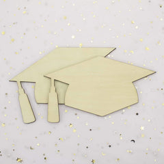 Two beige graduation caps on a light gray background with star confetti