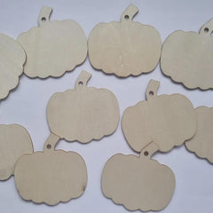 Beige pumpkin-shaped tags on a white background