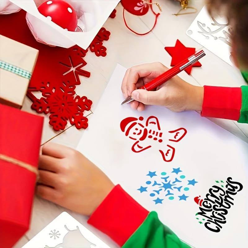 Children's hands coloring Christmas-themed designs on paper with red and green sleeves.
