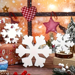 Decorative snowflakes on a Christmas-themed background with presents and stars.