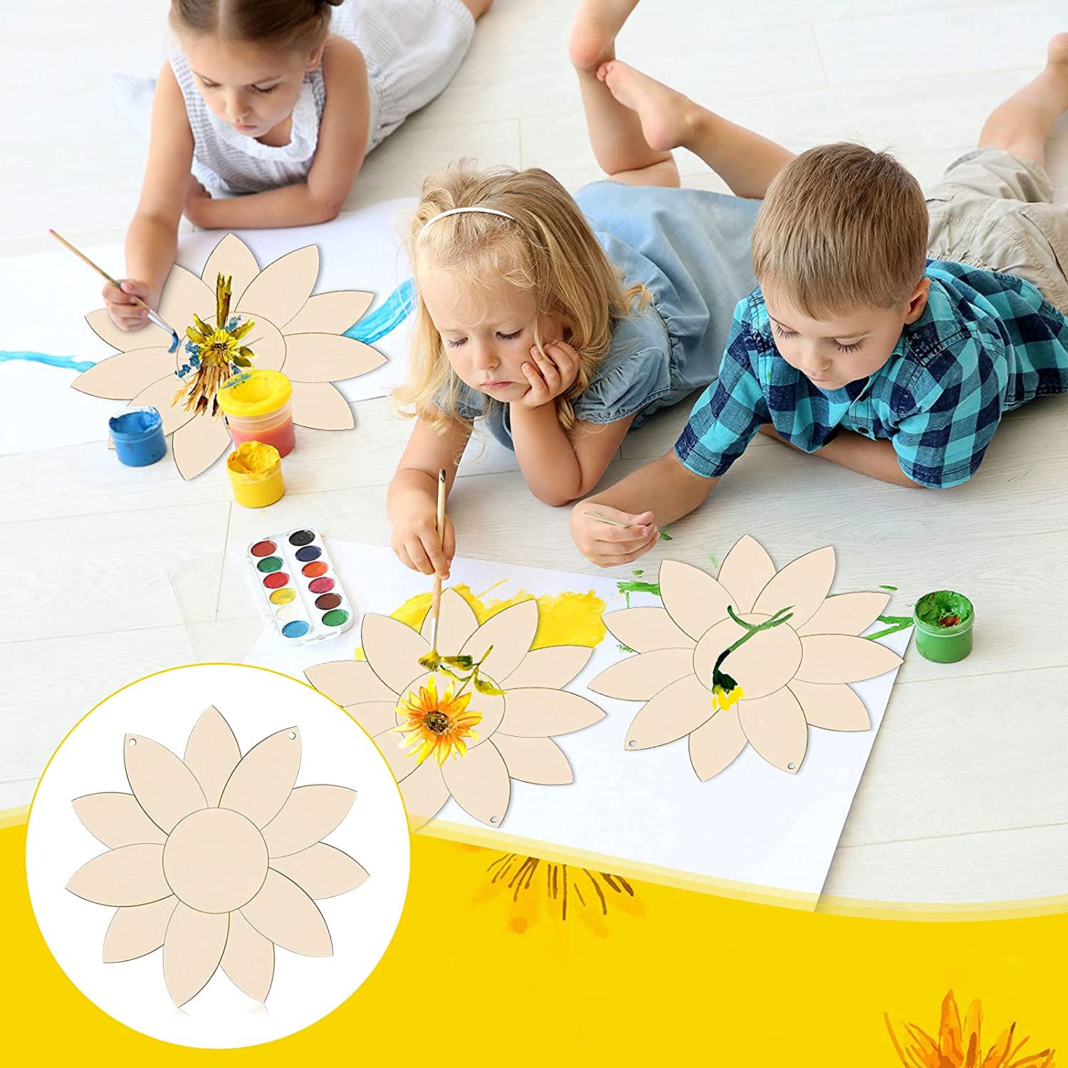 Children painting wooden flower shapes on a light-colored floor.