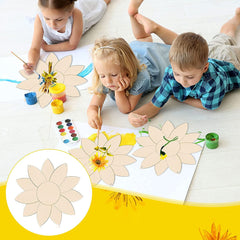 Children painting wooden flower shapes on a light-colored floor.