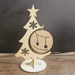 Wooden Christmas tree decoration with star and snowflakes on a dark background