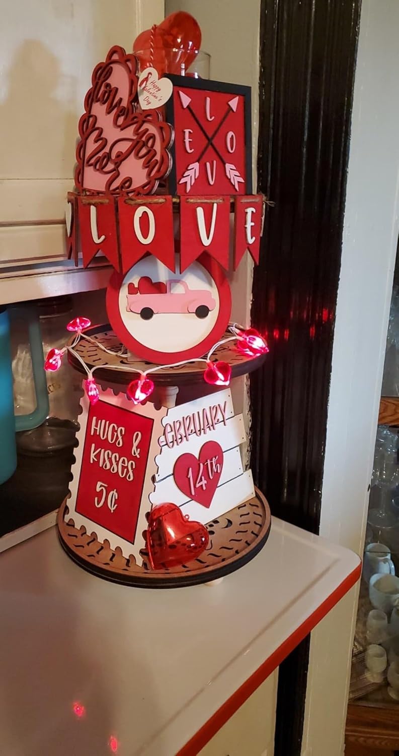 Decorative stand with Valentine's Day-themed elements on a white surface.