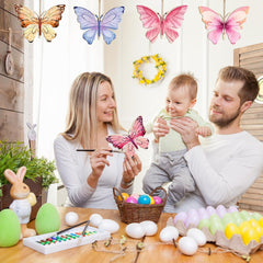 Family with a baby engaging in Easter activities with colorful butterflies and eggs.