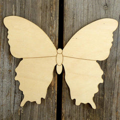 Wooden butterfly cutout on a wooden background