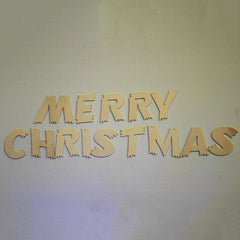 Wooden 'Merry Christmas' letters on a light background