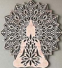 Decorative wall art with a mandala design featuring a silhouette of a person in a meditative pose on a gray background.
