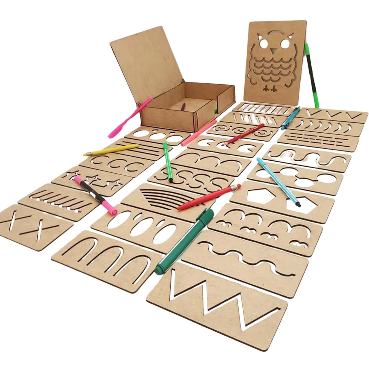 Set of cardboard stencils with drawing tools on a white background