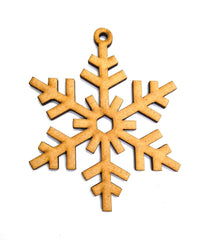 Wooden snowflake ornament on a white background