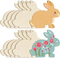 Set of wooden bunny shapes with one painted in brown and another with floral design on a white background.