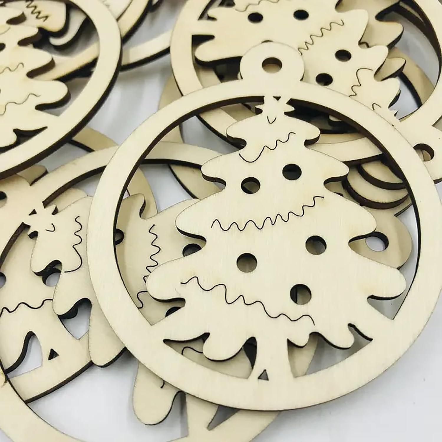 Wooden Christmas tree ornaments on a white background