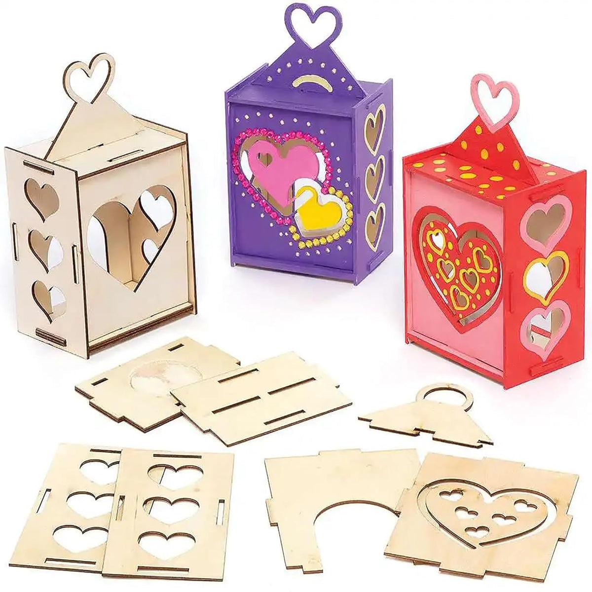 Set of wooden heart-shaped lanterns in various colors with unassembled pieces on a white background.