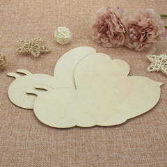 Wooden cloud-shaped decorative item on a textured fabric background with flowers and decorative elements.