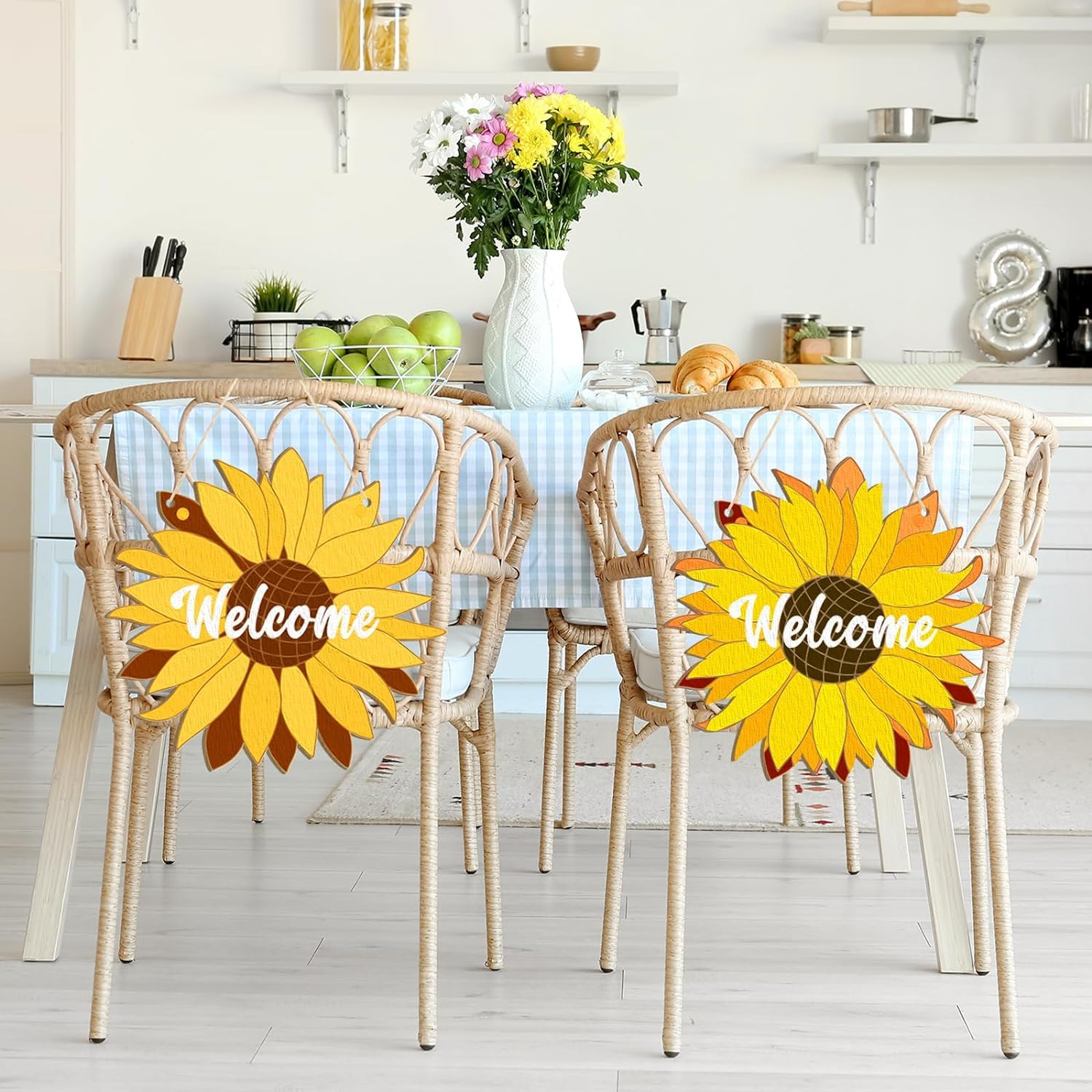 Two chairs with sunflower designs and 'Welcome' text in a kitchen setting.