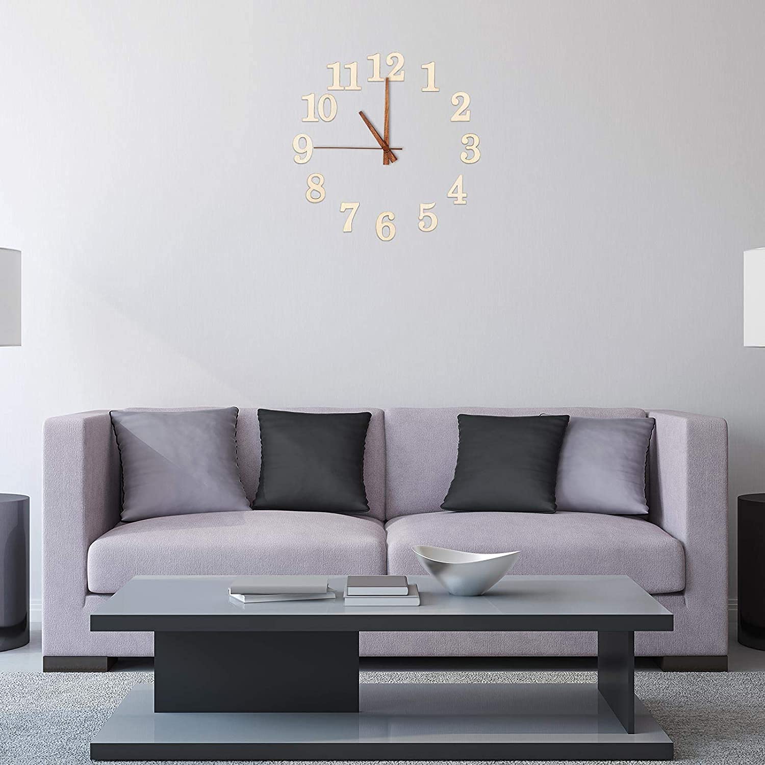 Modern living room with a gray sofa, coffee table, and decorative wall clock.