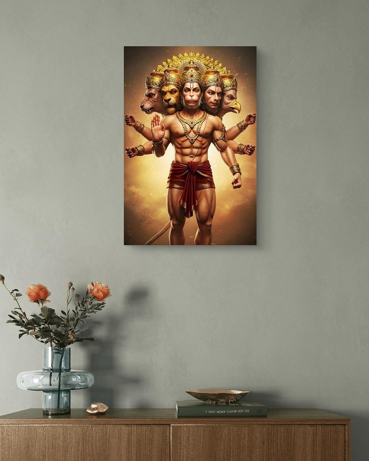 Framed artwork of a muscular figure with multiple heads on a gray wall above a wooden cabinet.