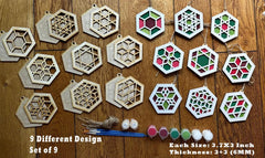 Set of 9 geometric wooden ornaments with paint and brushes on a wooden surface