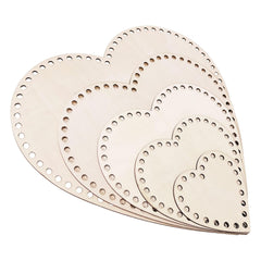 Set of heart-shaped wooden cutouts on a white background