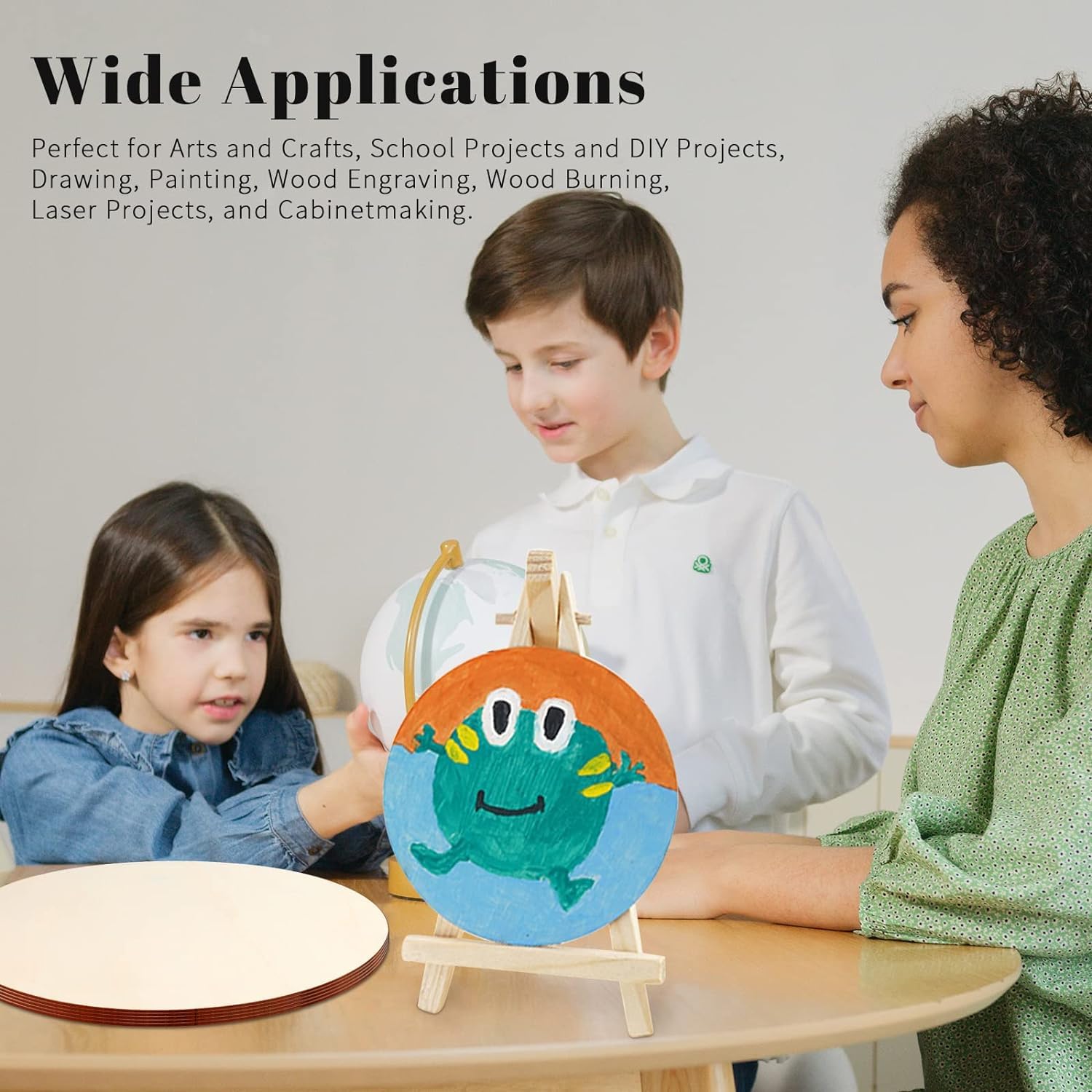 Children working on a craft project with a wooden stand and colorful frog design.