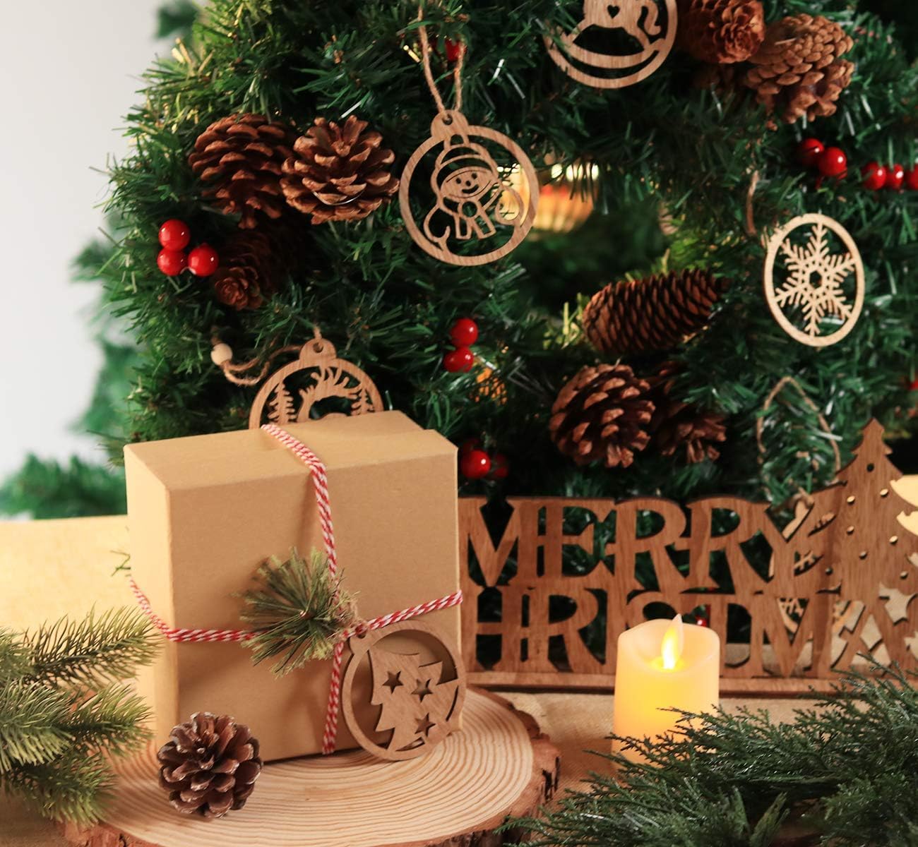 Gift wrapped in brown paper with decorative ribbons and ornaments on a Christmas tree.