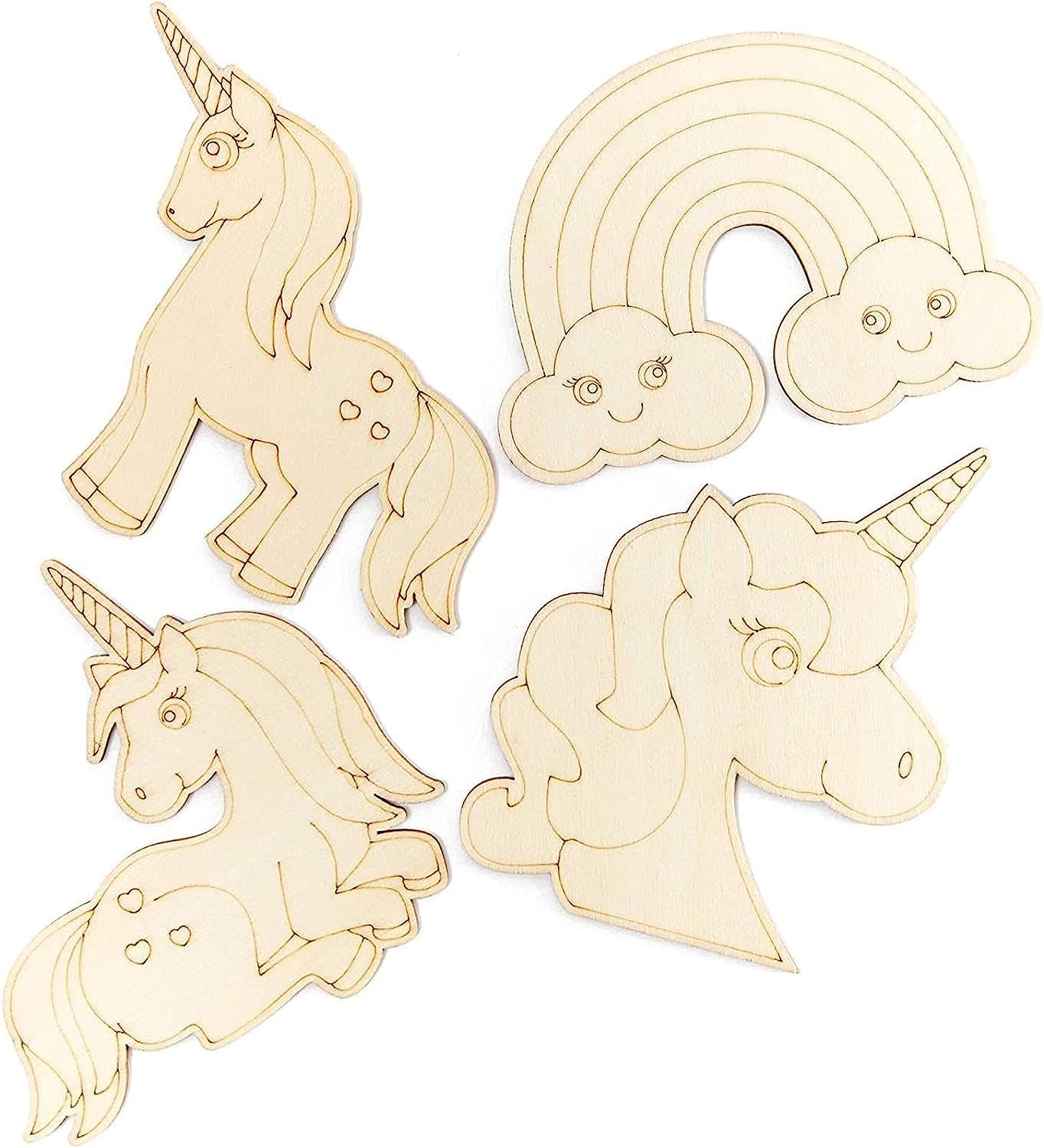 Set of wooden unicorn and rainbow decorations on a white background