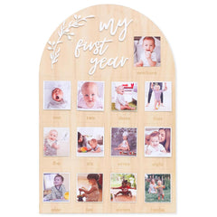 Wooden photo display with 'my first year' text and baby photos.