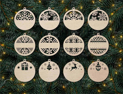 Set of wooden Christmas ornaments with various cut-out designs on a green pine branch background.