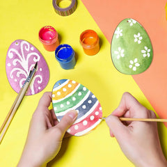 Colorful Easter egg painting activity on a yellow and orange background