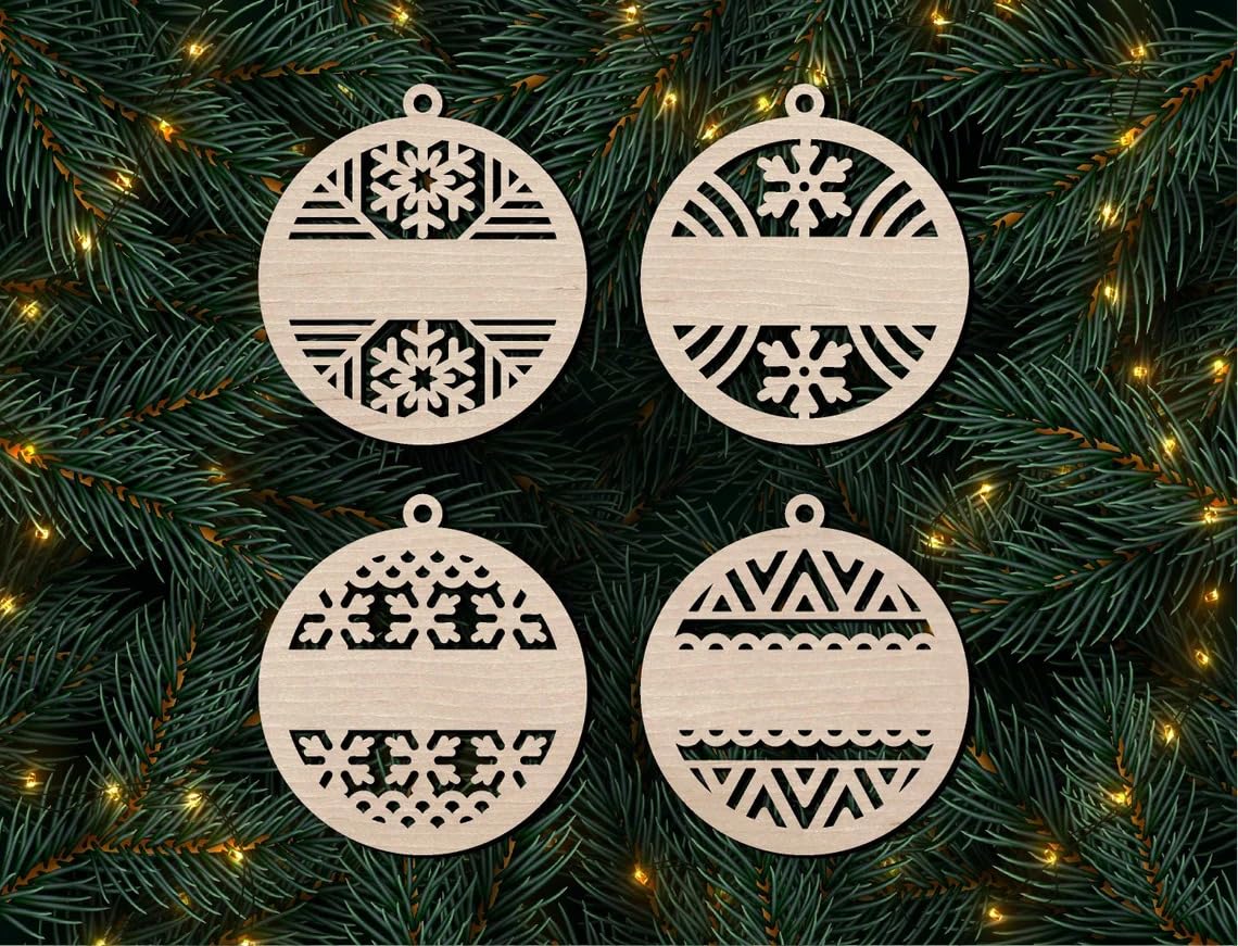 Four wooden Christmas ornaments with geometric patterns on a green pine branch background.