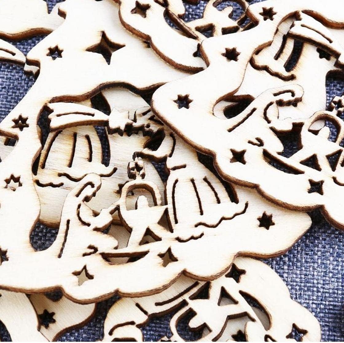 Wooden Christmas tree and angel decorations on a blue fabric background