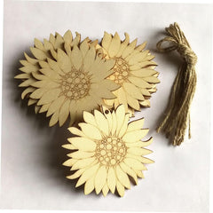 Three sunflower-shaped wooden coasters with a string on a white background
