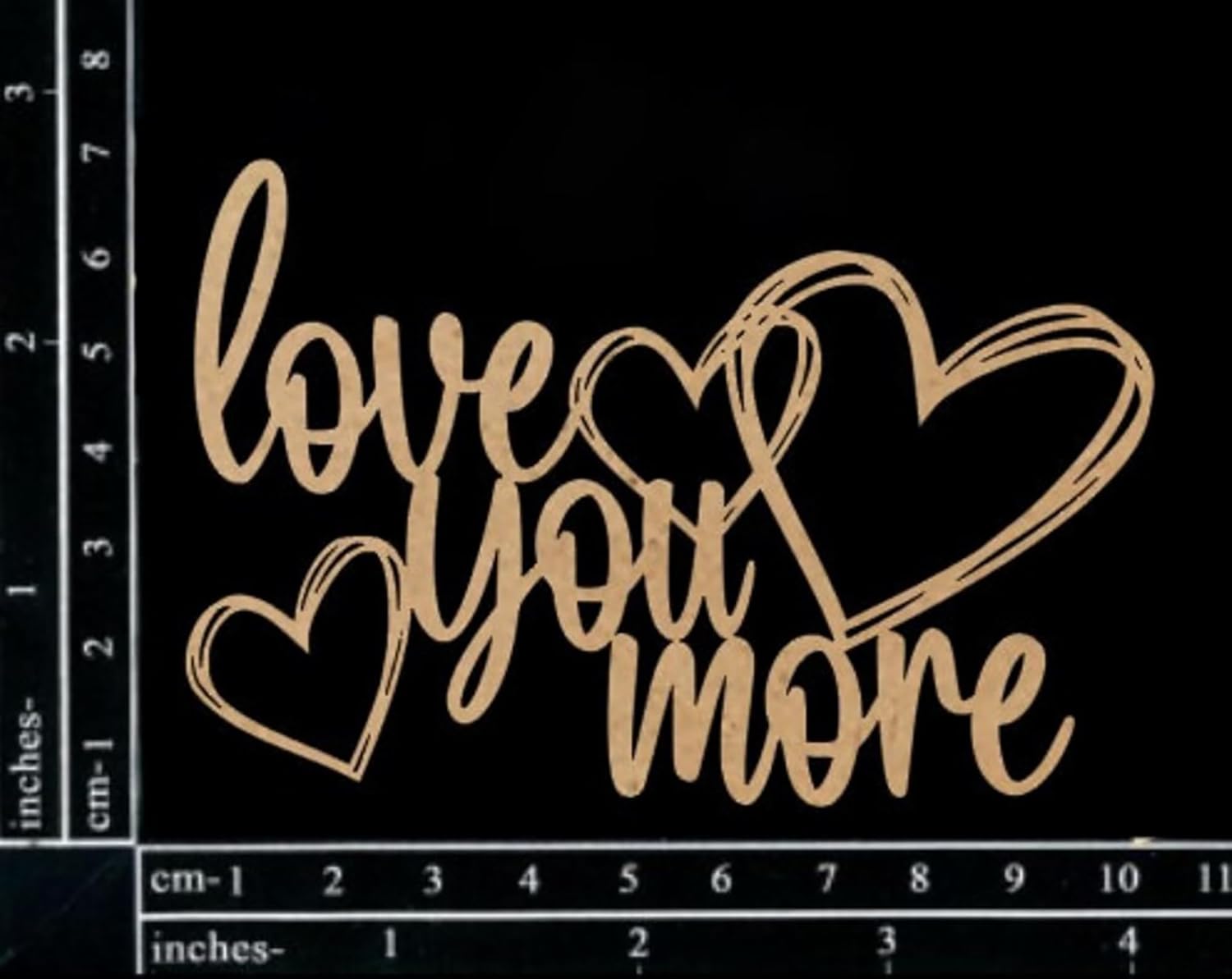 Decorative sign with 'love you more' text and hearts on a black background with measurement scale.