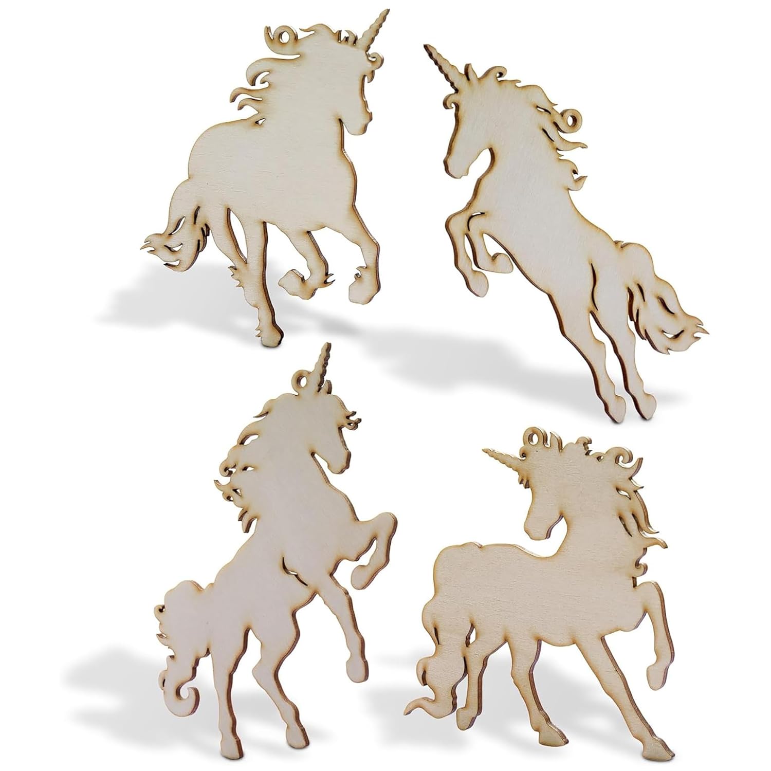 Four wooden unicorn figurines on a white background