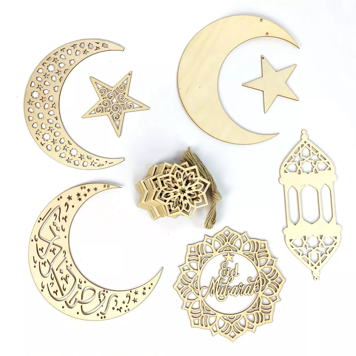 Set of gold metal decorations including crescent moons, stars, and Islamic calligraphy on a white background
