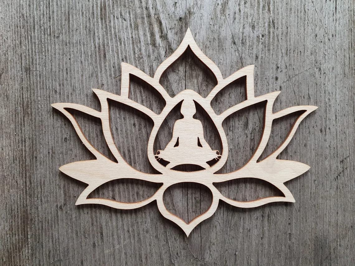 Wooden lotus flower wall art with a silhouette of a meditating figure on a wooden background