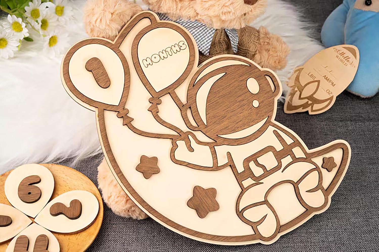 Wooden astronaut puzzle with numbers next to a teddy bear
