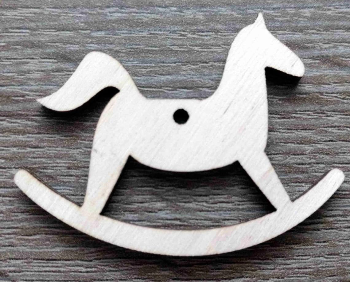 Wooden rocking horse toy on a wooden surface