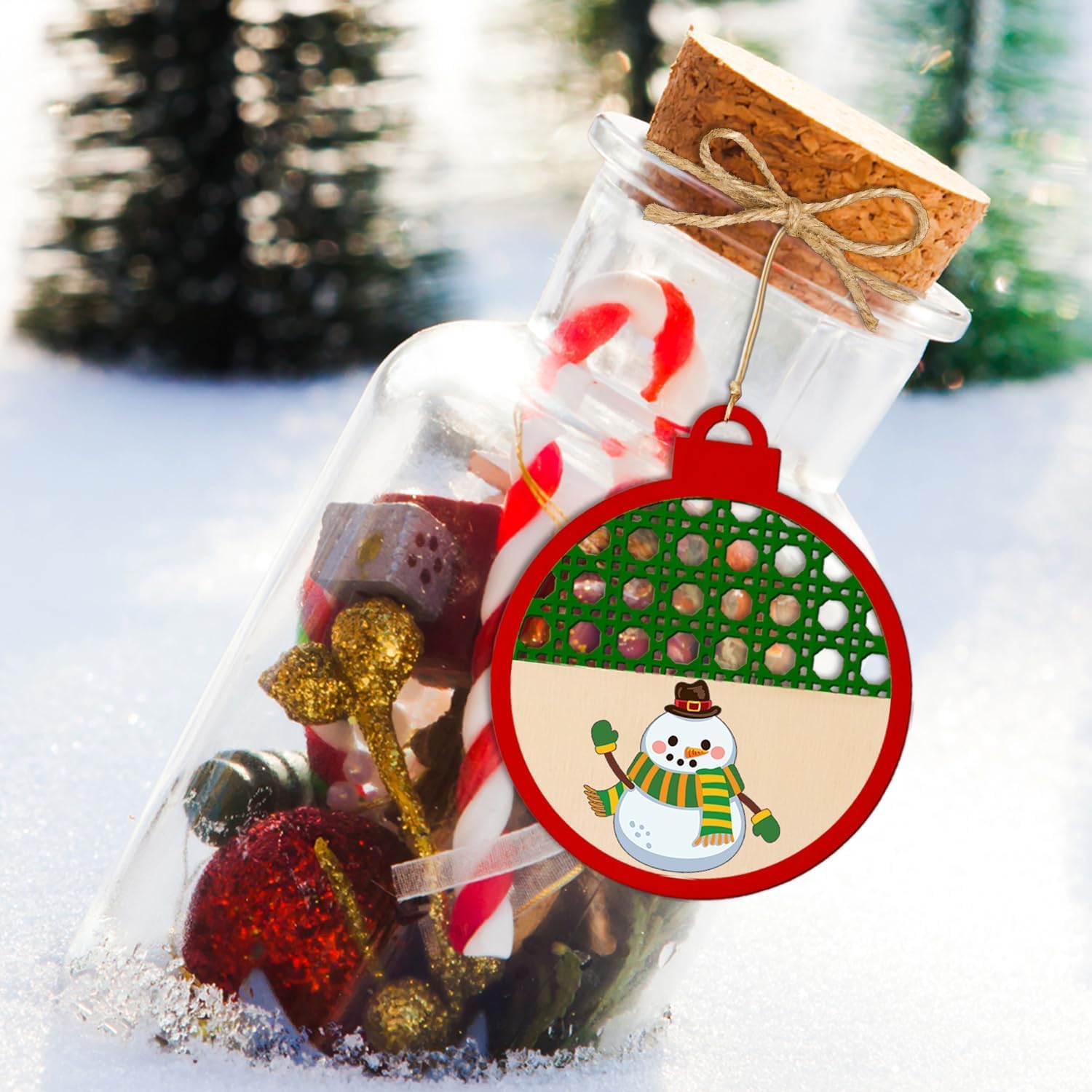 Decorative bottle with Christmas-themed items and a snowman ornament on a snowy background