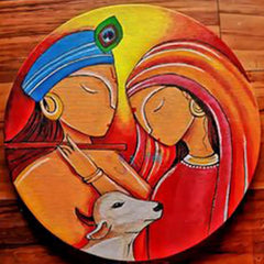 Decorative plate with a colorful depiction of a woman, child, and cow on a wooden surface.