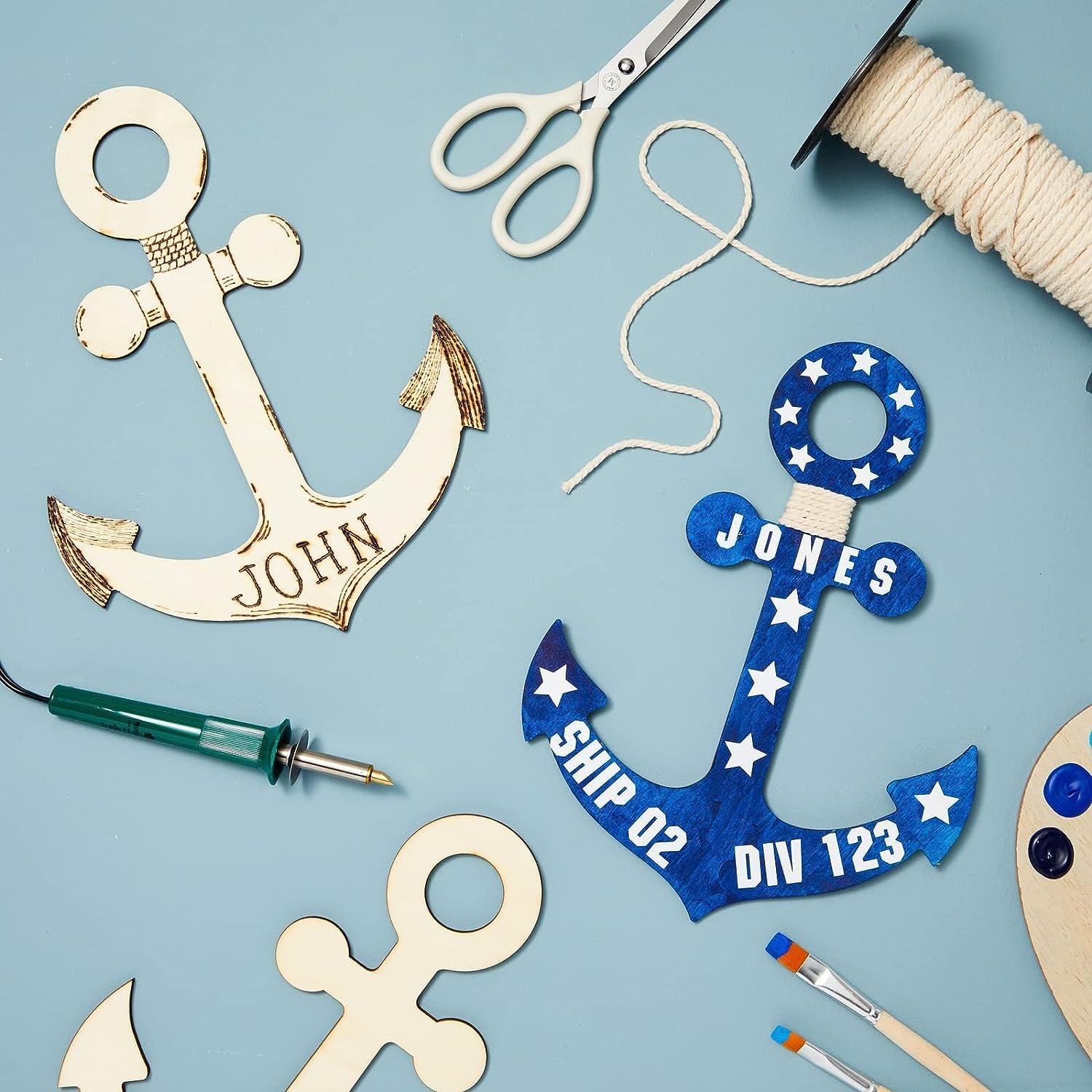 Wooden anchor-shaped decorations with customizable text on a blue background, surrounded by crafting tools.